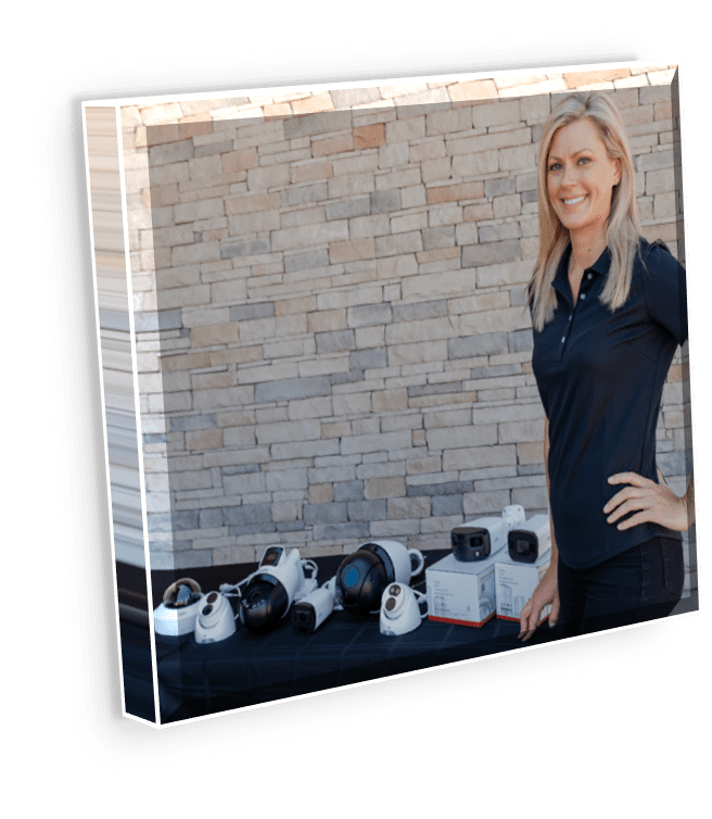 Ashley Cameras Box Woman with security cameras on display.